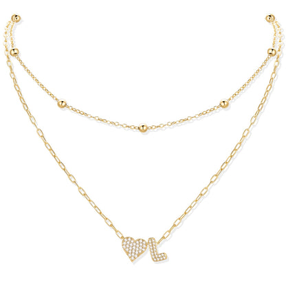 Gold cz initial L necklace with a heart-shaped pendant on a white background