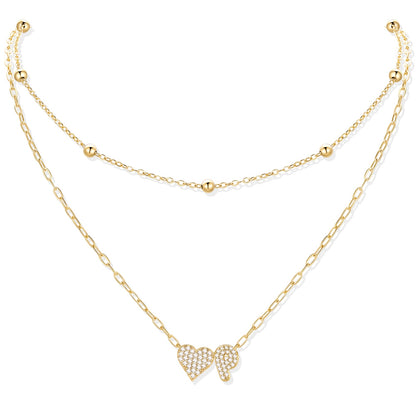Gold cz initial P necklace with a heart-shaped pendant on a white background