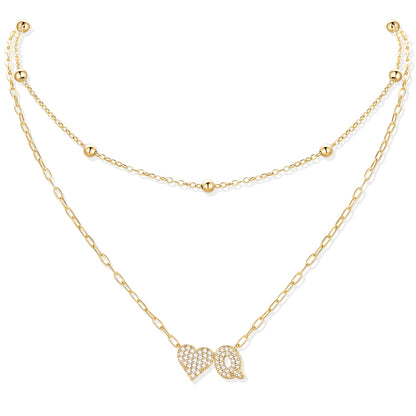 Gold cz initial Q necklace with a heart-shaped pendant on a white background