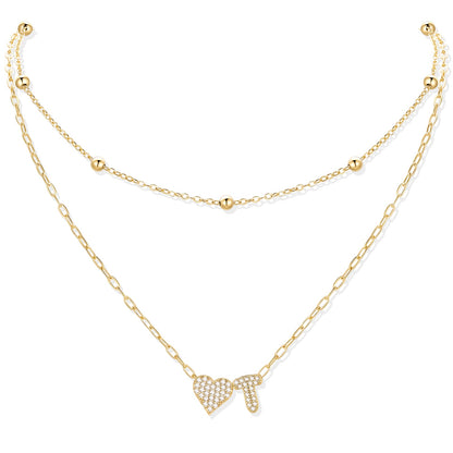 Gold cz initial T necklace with a heart-shaped pendant on a white background