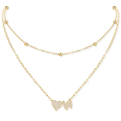Gold cz initial W necklace with a heart-shaped pendant on a white background