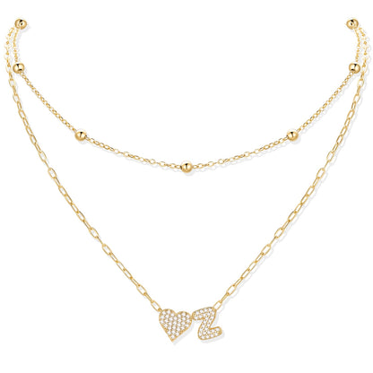Gold cz initial Z necklace with a heart-shaped pendant on a white background
