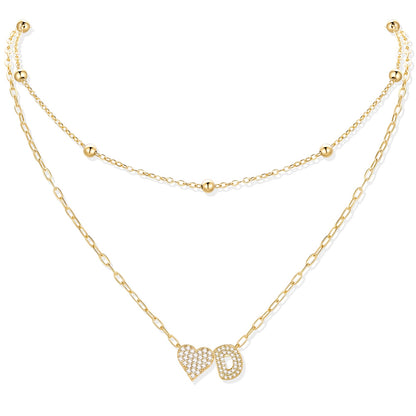 Gold cz initial d necklace with a heart-shaped pendant on a white background