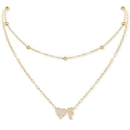 Gold cz initial f necklace with a heart-shaped pendant on a white background