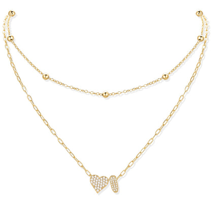 Gold cz initial i necklace with a heart-shaped pendant on a white background