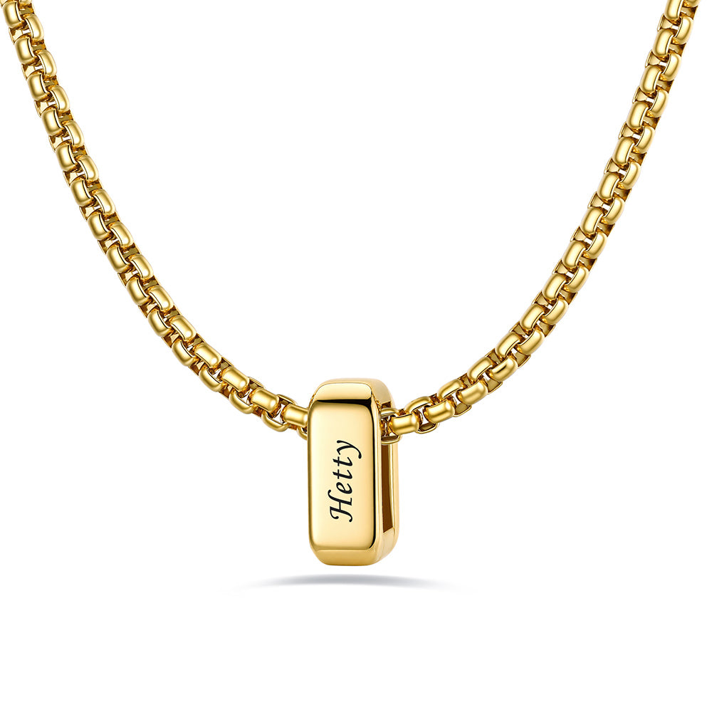 Gold engraved name necklace with 1 name bars on a white background