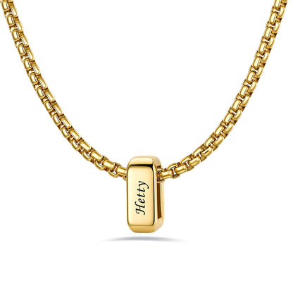Gold engraved name necklace with 1 name bars on a white background