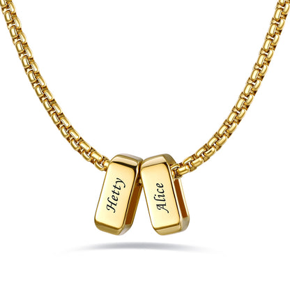 Gold engraved name necklace with 2 name bars on a white background