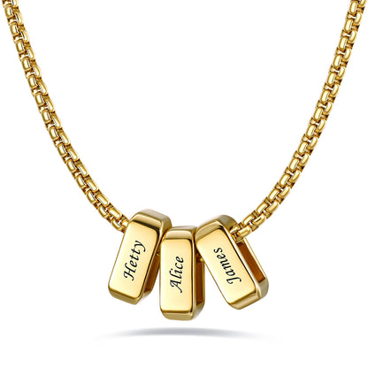 Gold engraved name necklace with 3 name bars on a white background