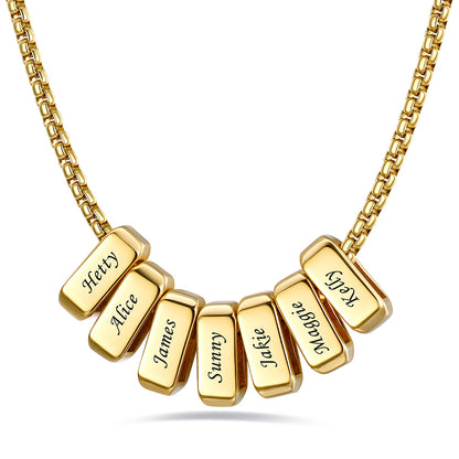 Gold engraved name necklace with 7 name bars on a white background