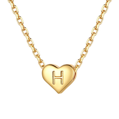 Gold heart initial necklace with an initial 'H' on a white background 