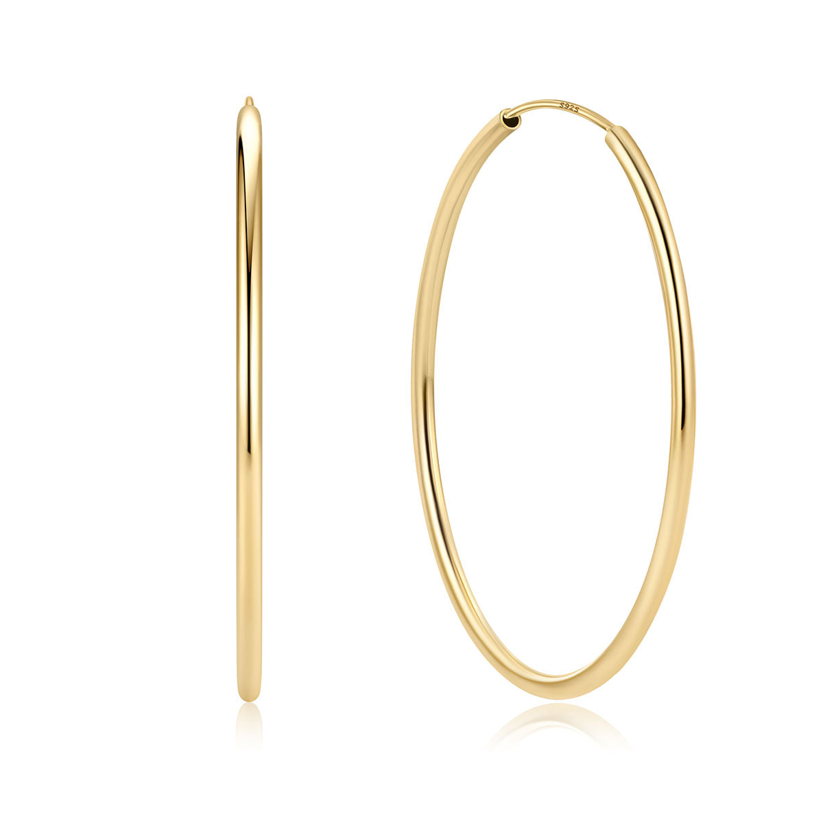 Gold hoop earrings on a white background 50mm