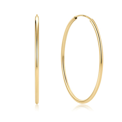 Gold hoop earrings on a white background 50mm