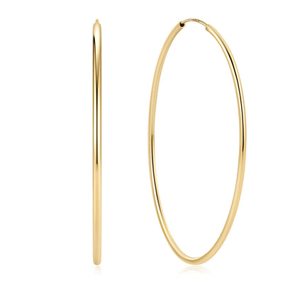 Gold hoop earrings on a white background 70mm 