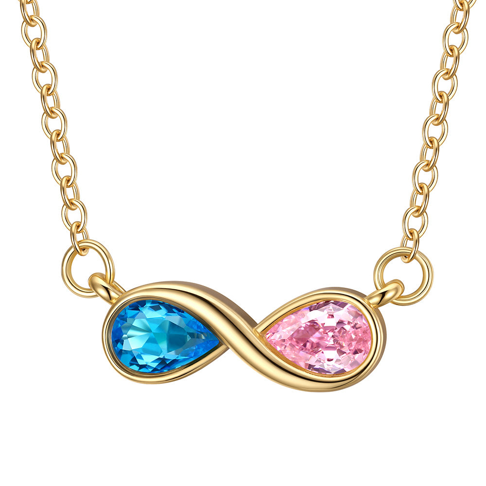 Gold infinity birthstone necklace with blue and pink gemstones on a white background