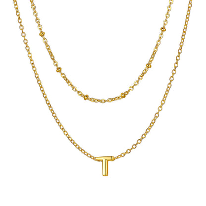 Gold initial necklace with a 'T' pendant on a white background