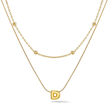 Gold layered initial D necklace, showing measurements and material details.