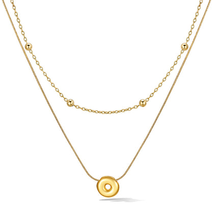 Gold layered initial O necklace with letter 'O' pendant, showing measurements and material details.