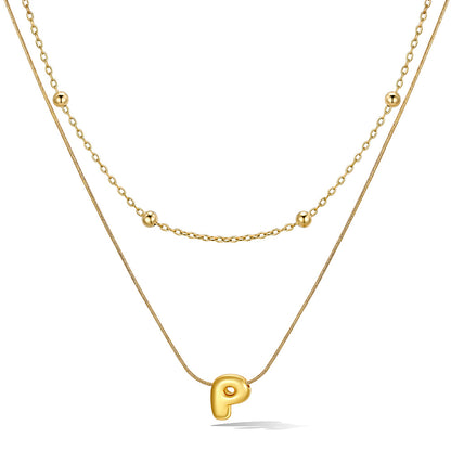 Gold layered initial P necklace with letter 'P' pendant, showing measurements and material details.