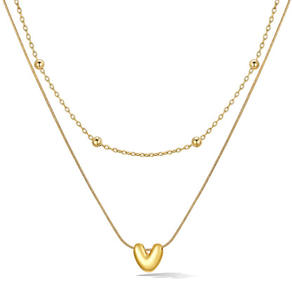 Gold layered initial V necklace with letter 'V' pendant, showing measurements and material details.
