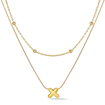 Gold layered initial X necklace with letter 'X' pendant, showing measurements and material details.