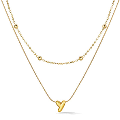 Gold layered initial Y necklace with letter 'Y' pendant, showing measurements and material details.