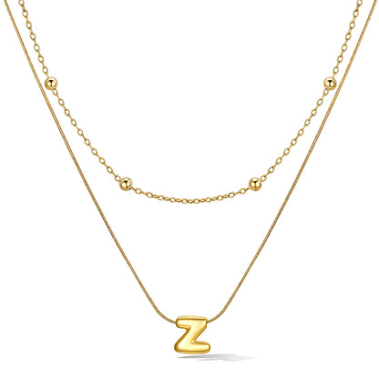 Gold layered initial Z necklace with letter 'Z' pendant, showing measurements and material details.