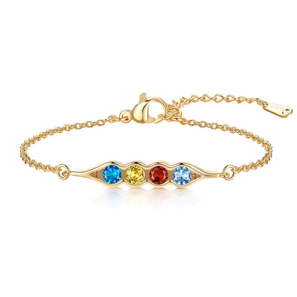 Gold pea in pot birthstone bracelet with four colored gemstones on a white background
