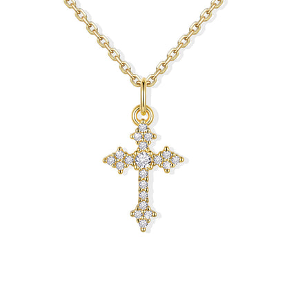 Gold cz cross pendant necklace with diamonds on a white background