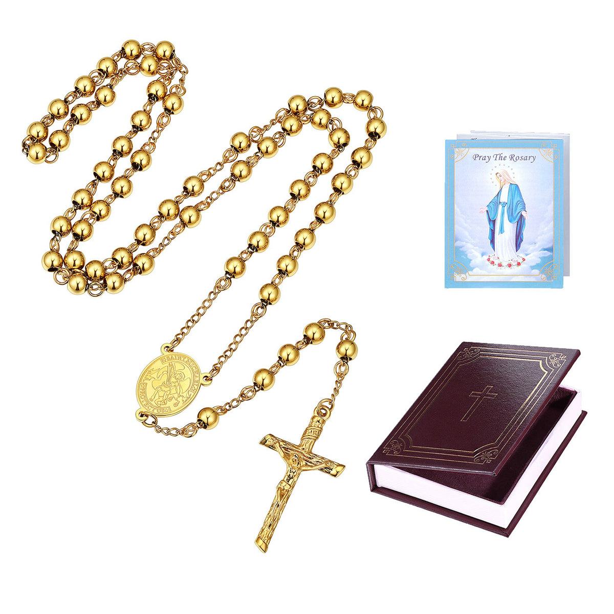 Gold rosary necklace with a medallion and crucifix, shown with a small prayer card and a dark brown book on a plain white background.