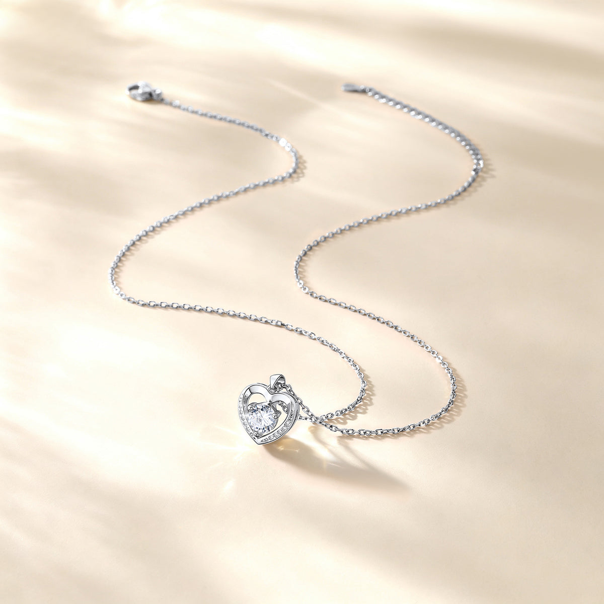 Heart cz necklace on a beige background
