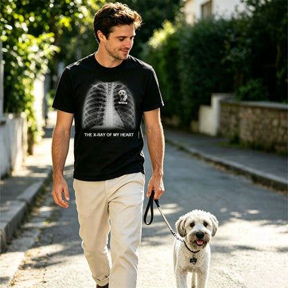 Man walking a dog on a leash in a residential area wearing a black custom text X-Ray t-shirt with a graphic design.