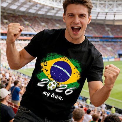 Man wearing a black t-shirt with a Brazilian flag design and '2026 my team' text in a stadium.