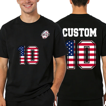 Black t-shirt with American flag design and 'Custom 10' text on front and back, worn by a person.
