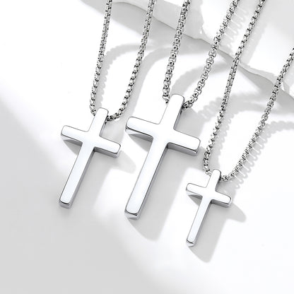 Three silver cross necklaces on a white background