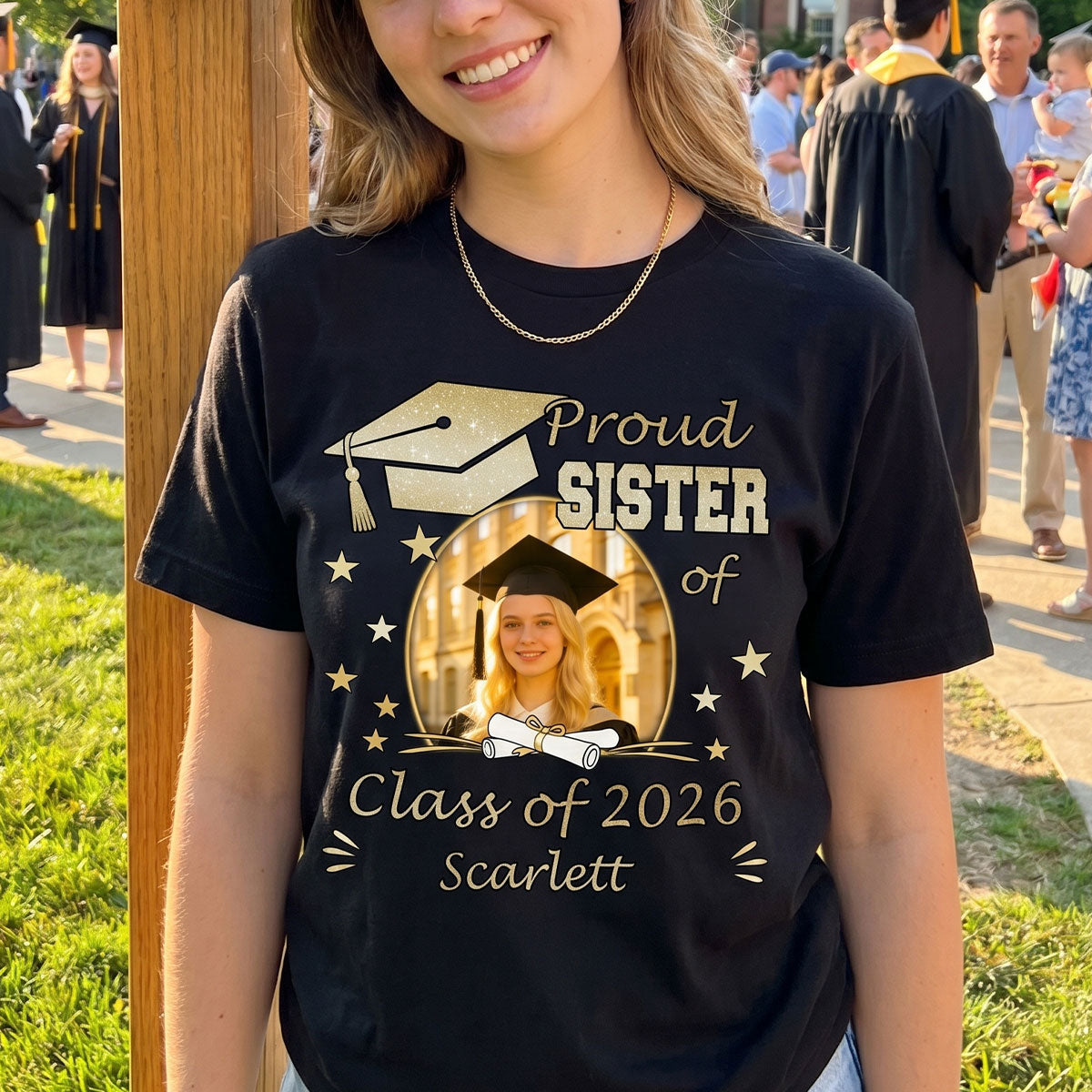 Person wearing a black 'Proud Sister of Class of 2026' graduation t-shirt with a photo of a graduate.