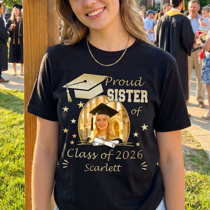 Person wearing a black 'Proud Sister of Class of 2026' graduation t-shirt with a photo of a graduate.