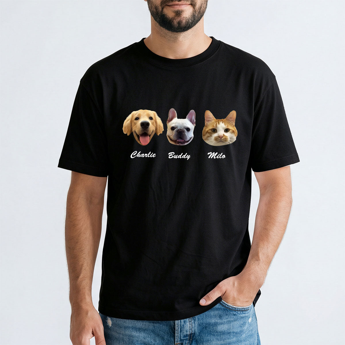 Person wearing a black t-shirt with dog and cat illustrations and names on a white background