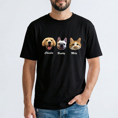 Person wearing a black t-shirt with dog and cat illustrations and names on a white background