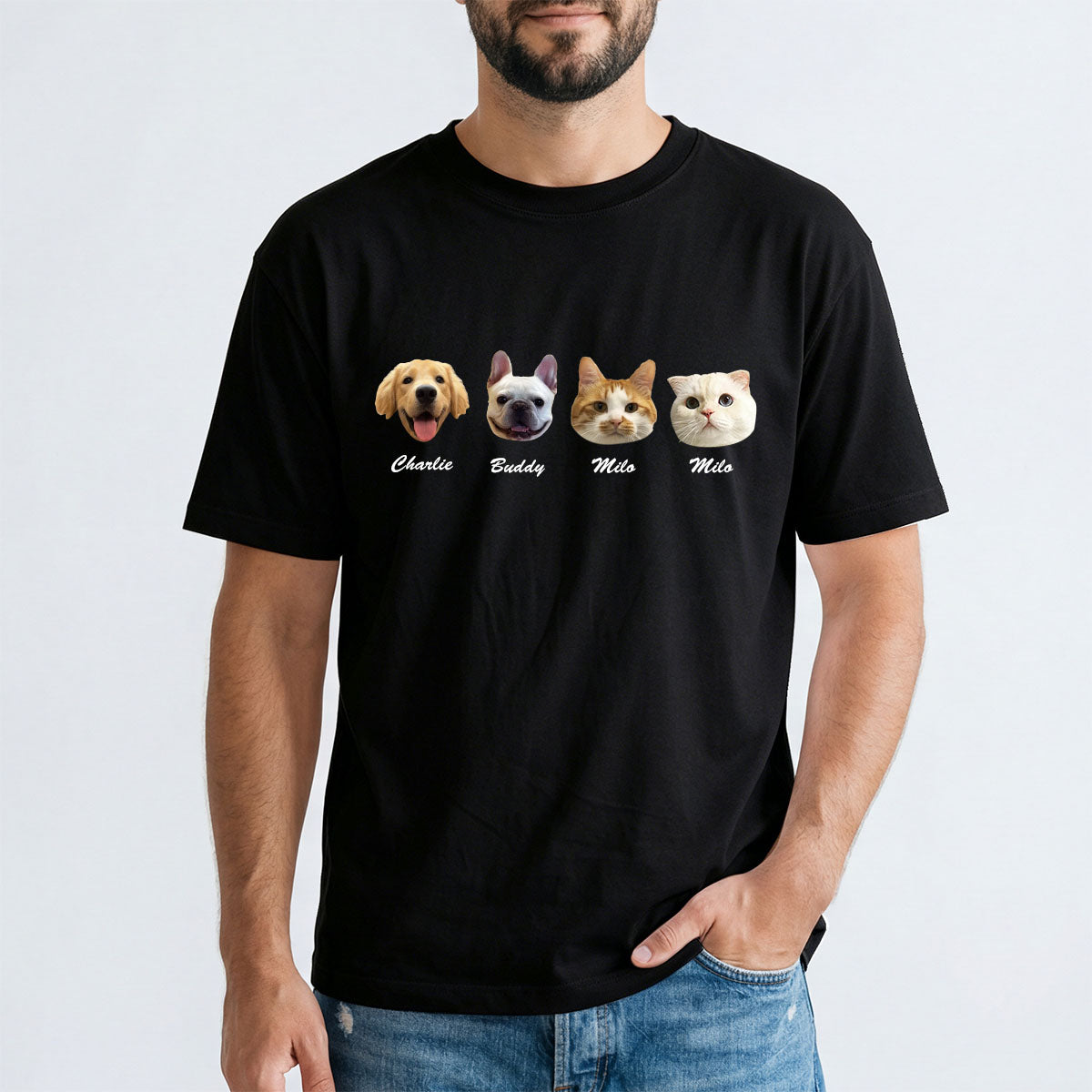 Person wearing a black t-shirt with four dog illustrations and names on a white background