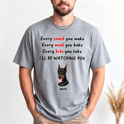 Person wearing a gray t-shirt with a dog graphic and text on a white background