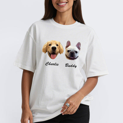Person wearing a white custom pet t-shirt with two dog illustrations and names 'Charlie' and 'Buddy'.