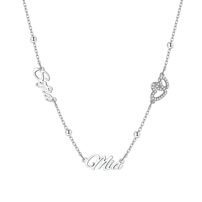 Personalized engraved nameplate necklace with heart detail on a white background