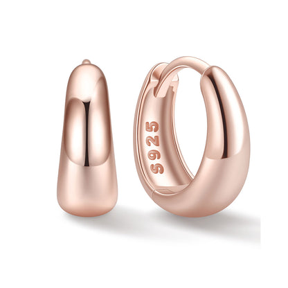 Rose Gold 10mm Chunky huggie earrings on a white background