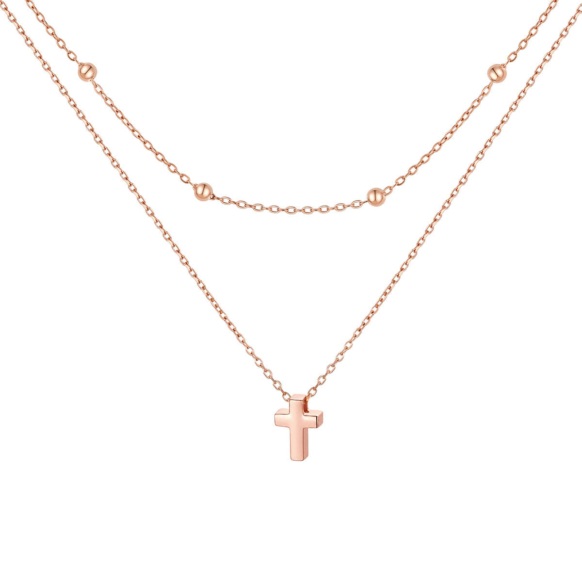 Rose gold cross necklace on a white background