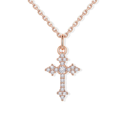 Rose gold cross necklace with diamonds on a white background