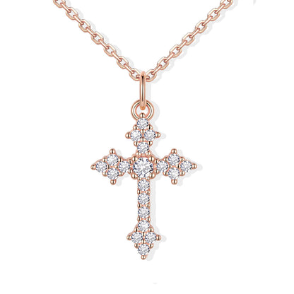 Rose gold cross pendant necklace with diamonds on a white background