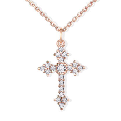 Rose gold cross pendant with diamonds on a white background