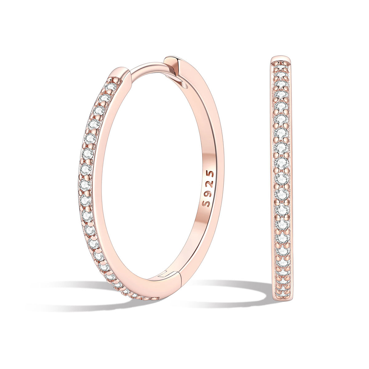 Rose gold cz huggie earrings with embedded diamonds on a white background
