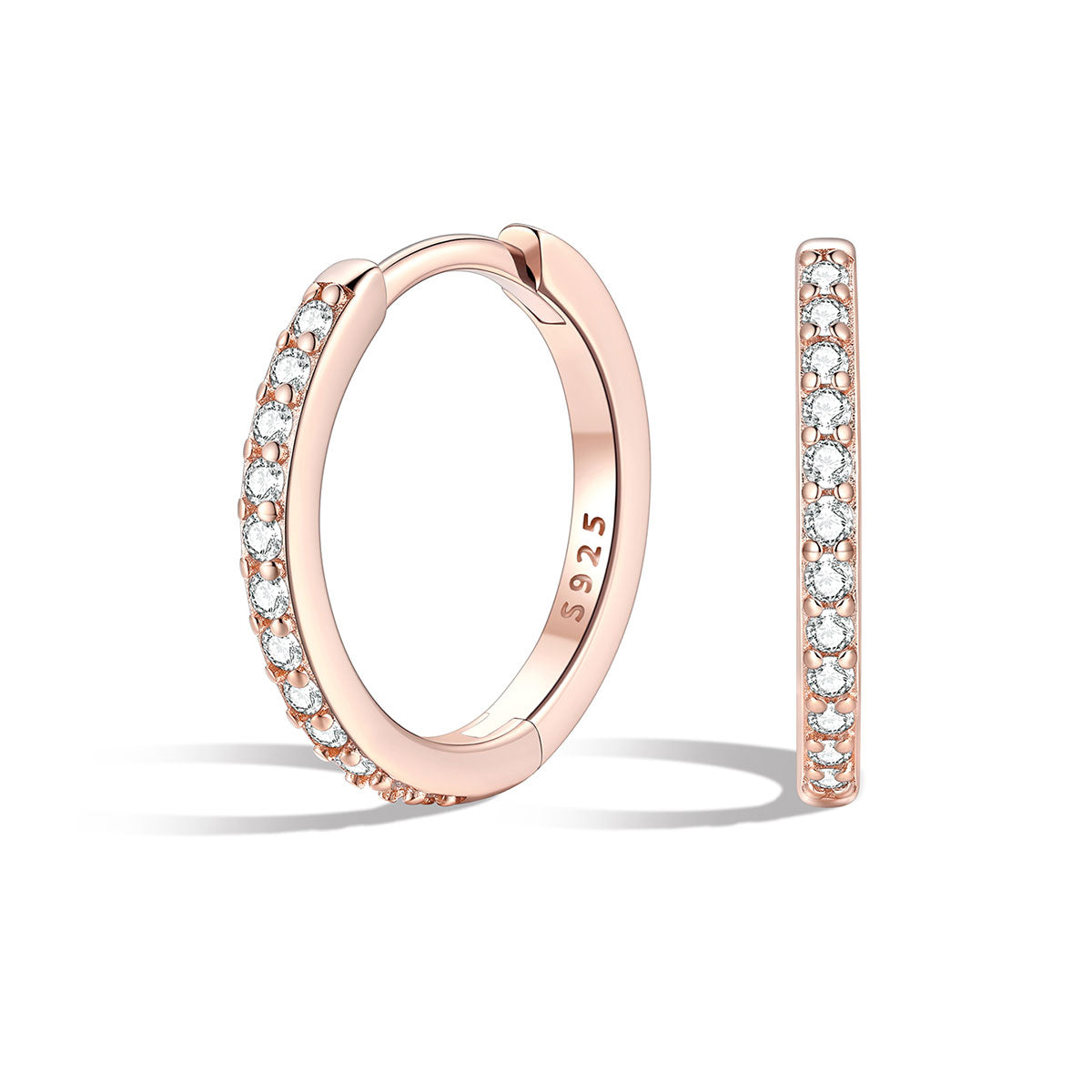 Rose gold cz huggie hoop earrings with embedded diamonds on a white background